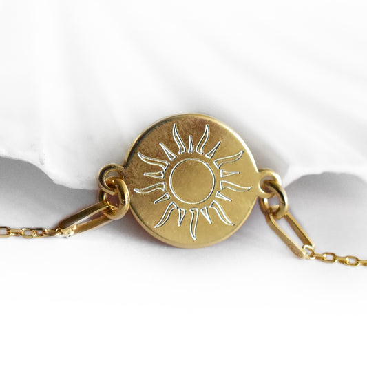 vergoldetes Armband mit Sonnenmotiv